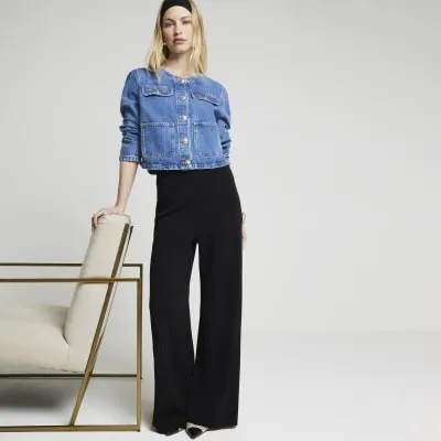 Black wide leg trousers sold by River Island