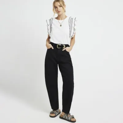 Cream frill stitched top sold by River Island