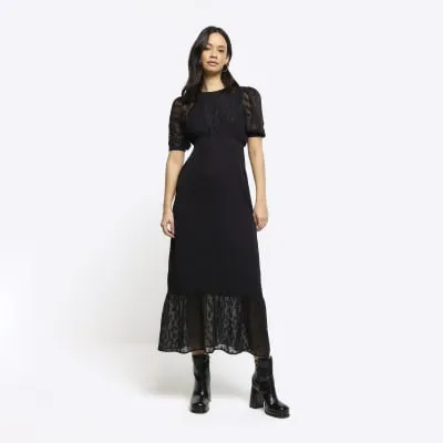 Black jacquard textured midi dress sold by River Island