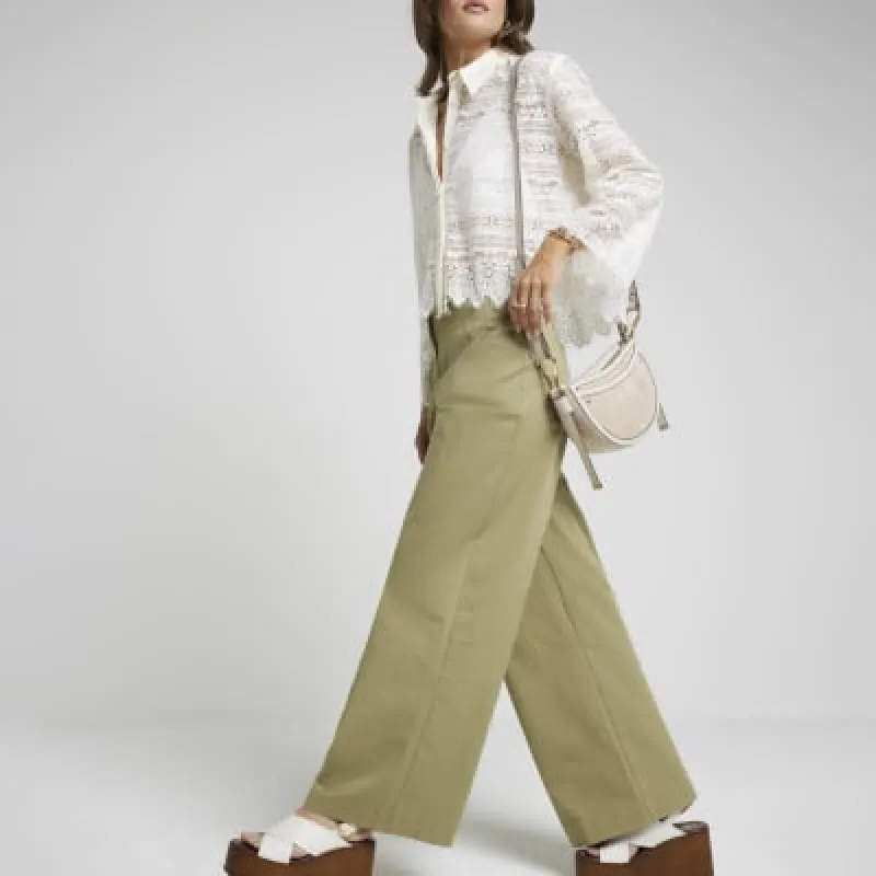 Cream suedette scoop cross body bag sold by River Island