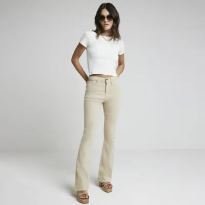 Beige high waisted kickflare jeans sold by River Island