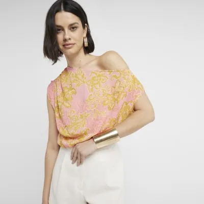 Pink floral print off shoulder top sold by River Island