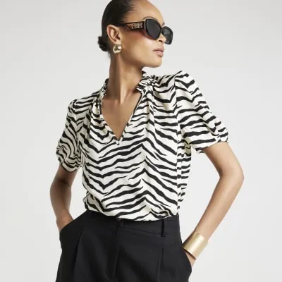 Cream zebra print blouse sold by River Island