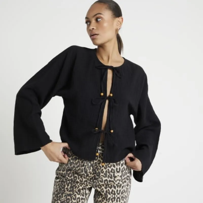 Black textured tie front top sold by River Island