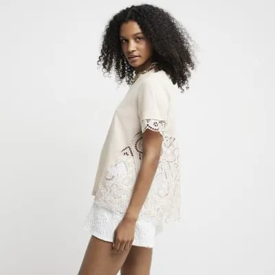 Beige broderie detail t-shirt sold by River Island