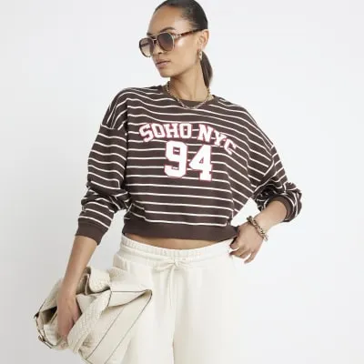 Brown stripe NYC crop sweatshirt sold by River Island