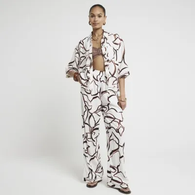 Brown linen blend abstract crochet trim shirt sold by River Island