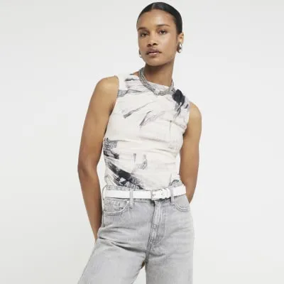 Cream floral drape sleeveless top sold by River Island