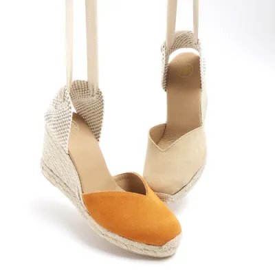 Orange suede wedge espadrille sandals sold by River Island