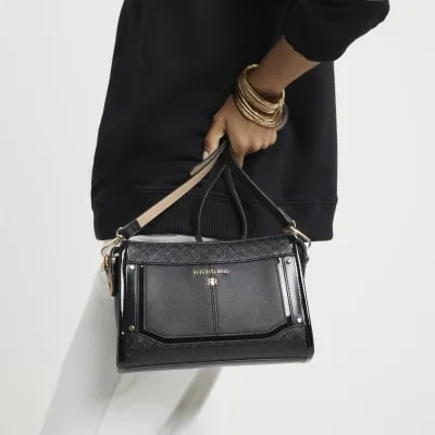 Black RI monogram panel cross body bag sold by River Island