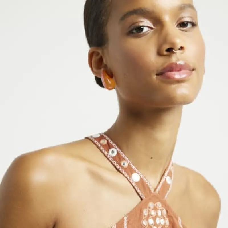 Orange Domed Earrings sold by River Island