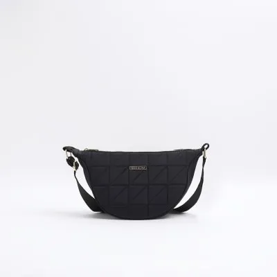 Black soft quilted cross body bag sold by River Island