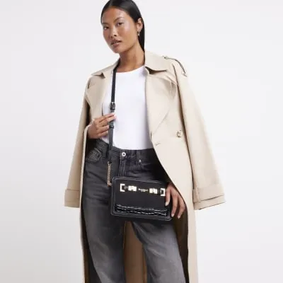 Black suedette boxy cross body bag sold by River Island