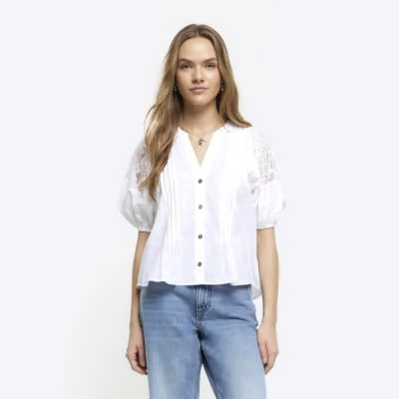 White lace panel puff sleeve blouse sold by River Island