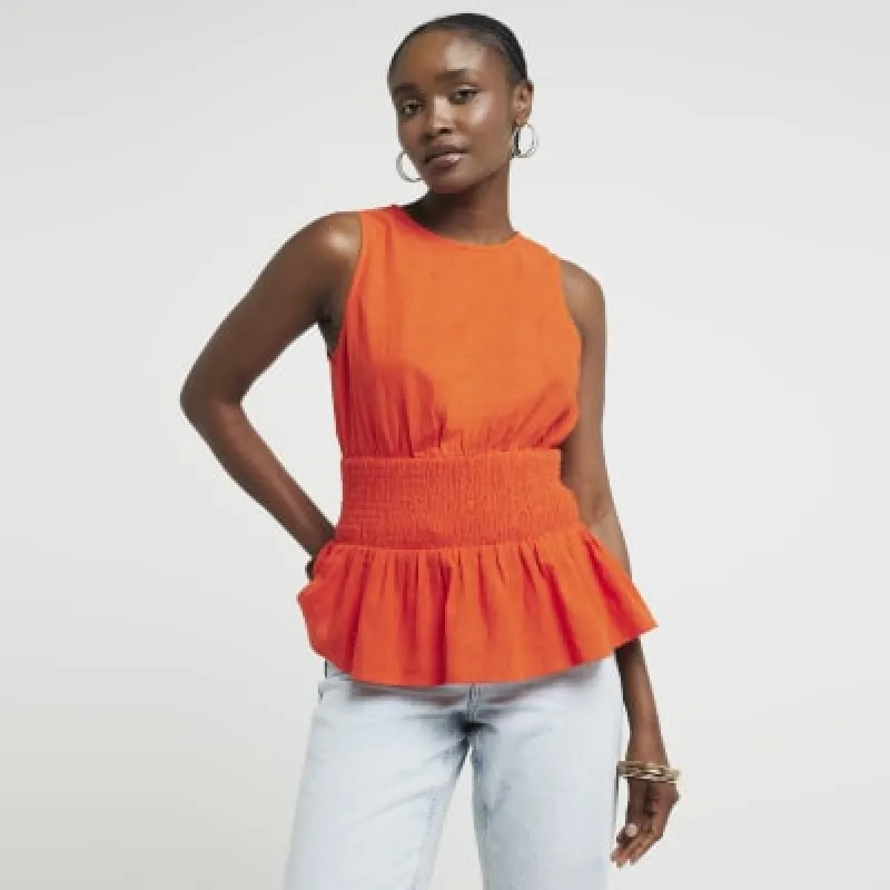 Red linen blend shirred peplum top sold by River Island
