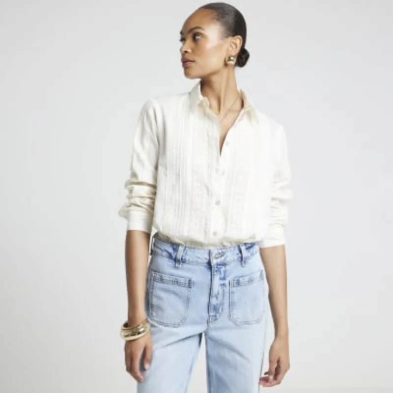 Cream lace panel shirt sold by River Island