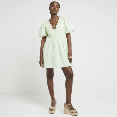 Green embroidered smock mini dress sold by River Island