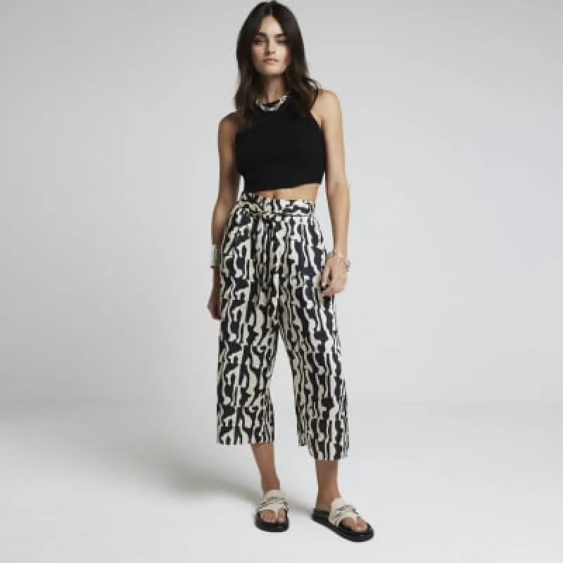 Black abstract tie waist cropped trousers sold by River Island