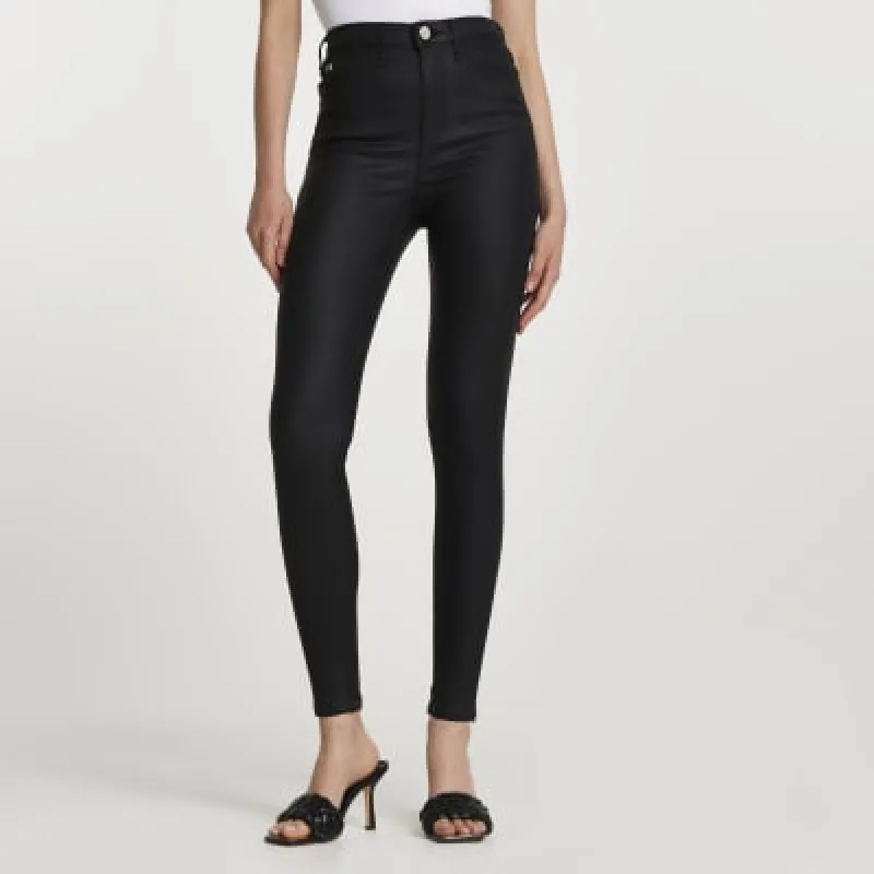 Black coated denim high waisted skinny jeans sold by River Island
