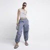 Grey parachute cargo trousers sold by River Island
