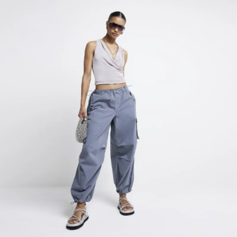 Grey parachute cargo trousers sold by River Island