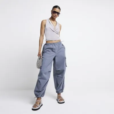 Grey parachute cargo trousers sold by River Island