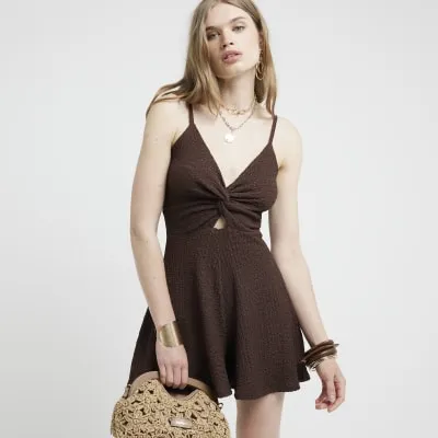 Brown textured twist playsuit sold by River Island