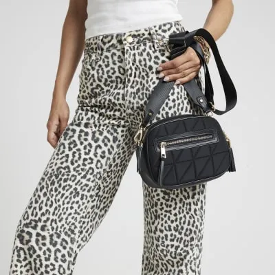 Black quilted cross body camera bag sold by River Island
