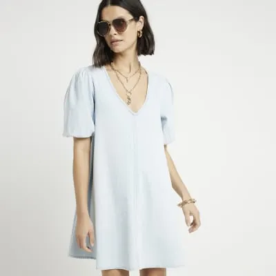 Blue denim puff sleeve smock mini dress sold by River Island