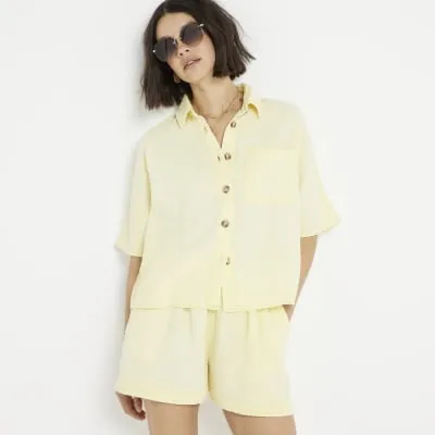 Yellow textured cropped shirt sold by River Island