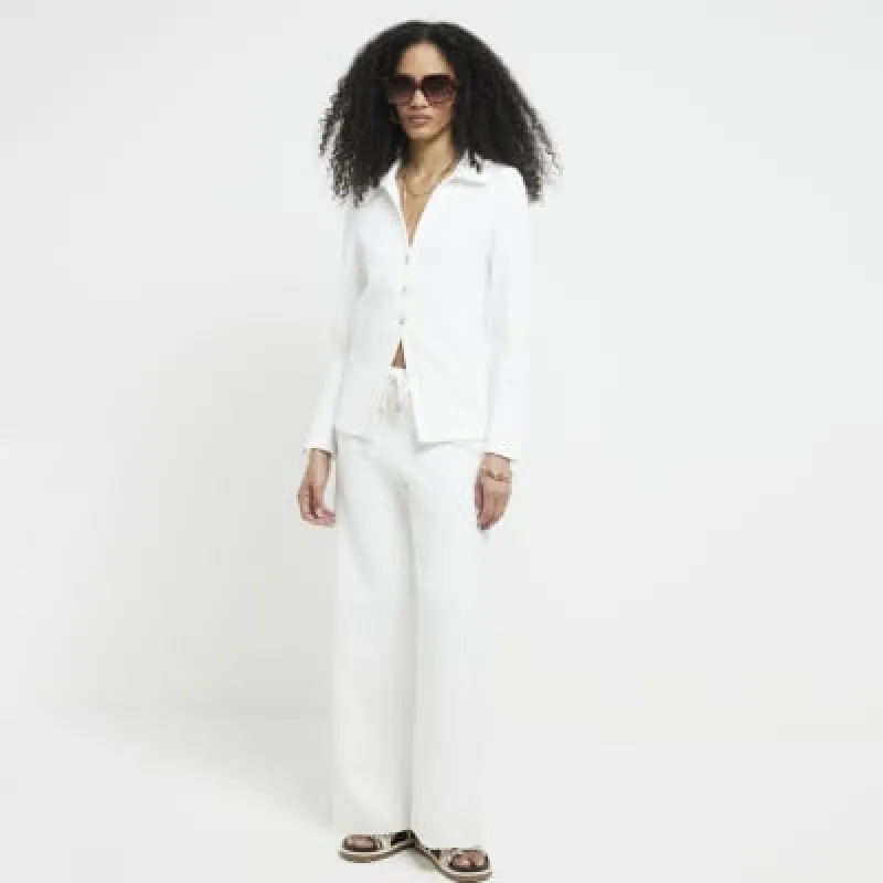 Cream textured long sleeve shirt sold by River Island