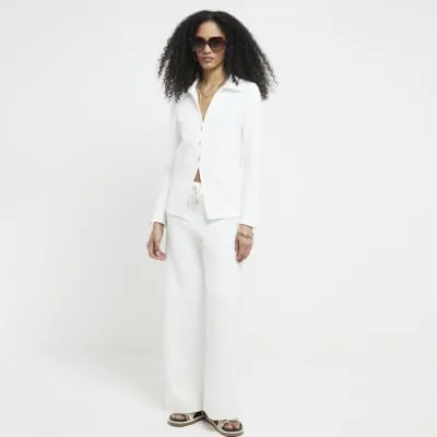 Cream textured long sleeve shirt sold by River Island