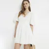Cream embroidered smock mini dress sold by River Island