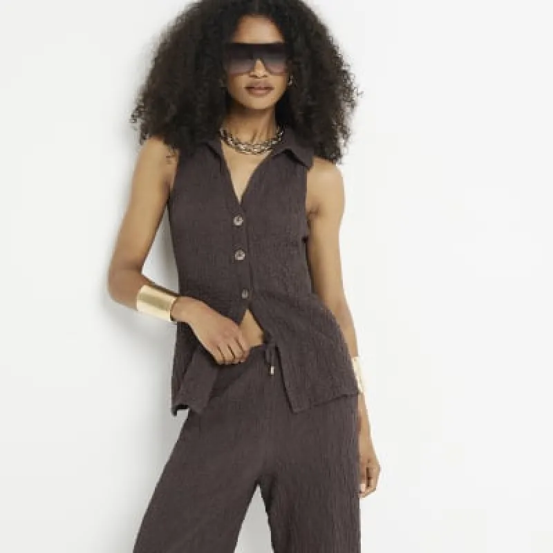 Brown textured sleeveless shirt sold by River Island