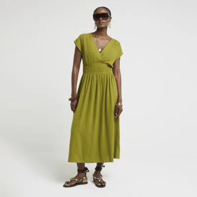 Khaki linen blend shirred skater midi dress sold by River Island