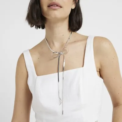 Silver Sleek Bow Necklace sold by River Island