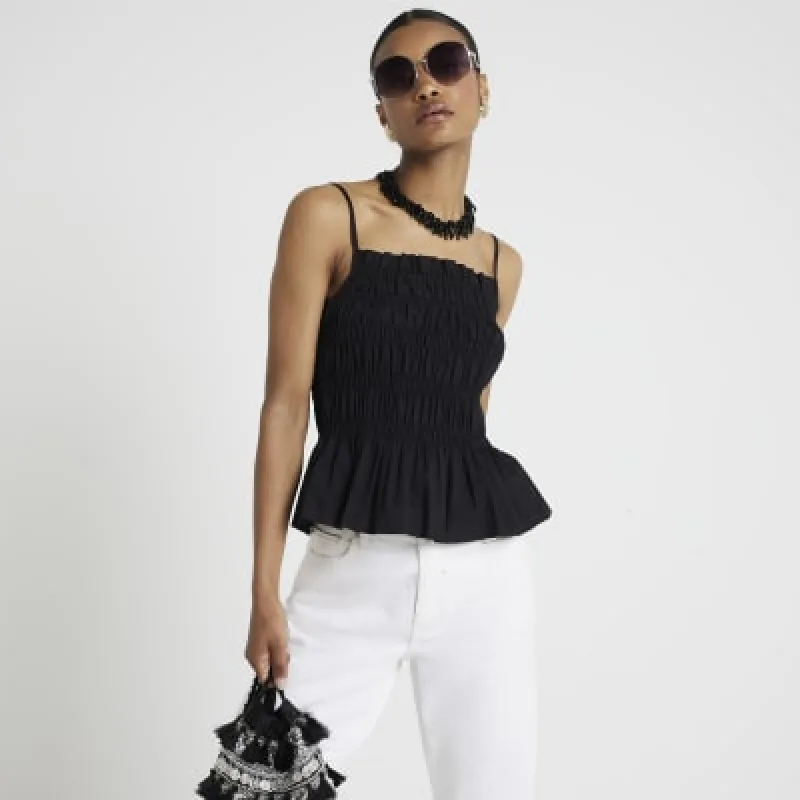 Black shirred cami top sold by River Island