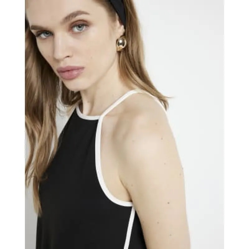 Black taped cami top sold by River Island