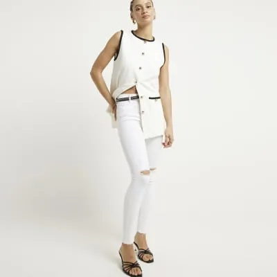 White mid rise molly sculpted jeans sold by River Island