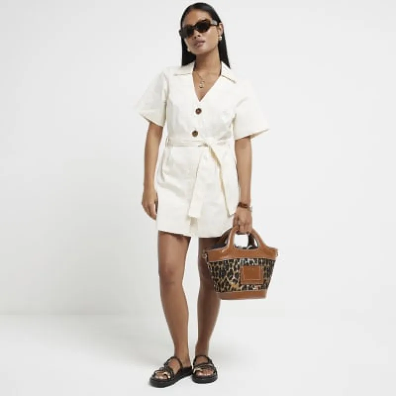 Petite beige belted skort playsuit sold by River Island