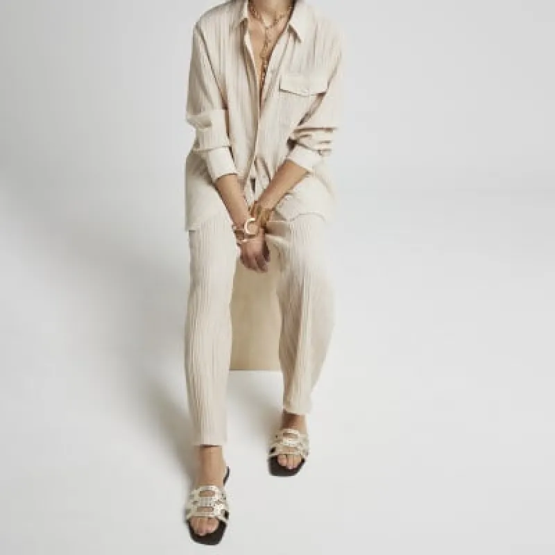 Gold leather studded mule flat sandals sold by River Island
