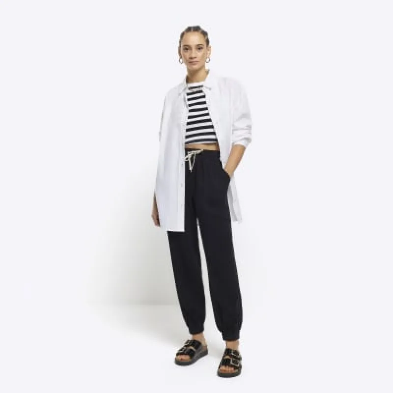 Black lyocell cuffed joggers sold by River Island