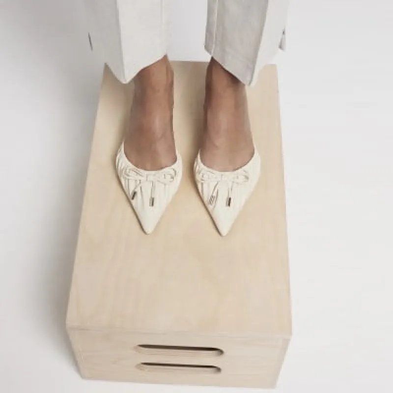 Cream ruched kitten heel court shoes sold by River Island