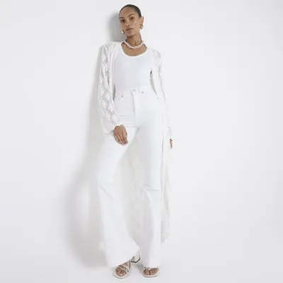 White High Waisted Tummy Hold Flared Jeans sold by River Island