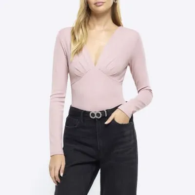 Pink plunge long sleeve bodysuit sold by River Island