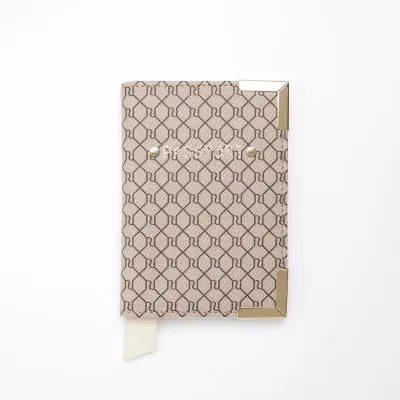 Brown RI monogram passport cover sold by River Island