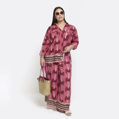 Plus pink palm tree wide leg beach trousers sold by River Island