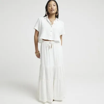 Petite white textured crop shirt sold by River Island
