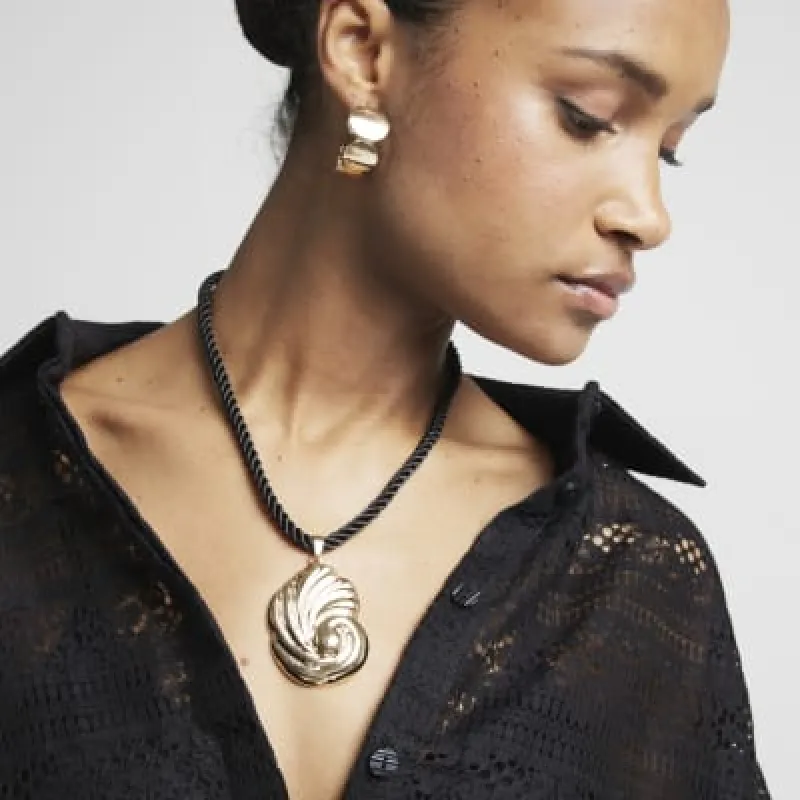Gold shell rope necklace sold by River Island