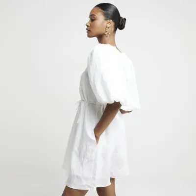 White belted puff sleeve swing mini dress sold by River Island